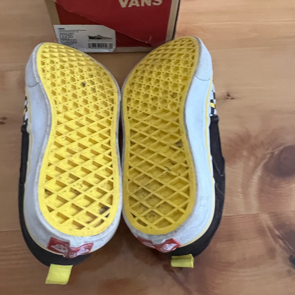 2 youth black, yellow, white checkered vans sneakers.